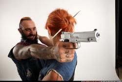 Edgar-pistols-pose4-cross-shooting