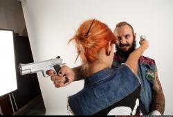 Edgar-pistols-pose4-cross-shooting