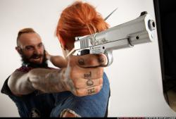 Edgar-pistols-pose4-cross-shooting