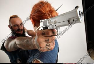 Edgar-pistols-pose4-cross-shooting