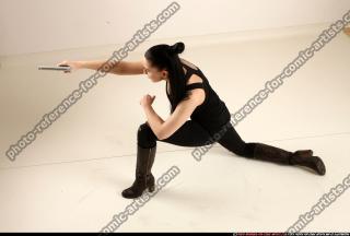 2017 05 CLAUDIA KNEELING AIMING PISTOL 02 A