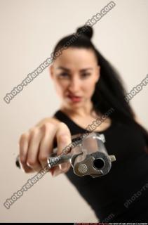 claudia-standing-aiming-pistol 