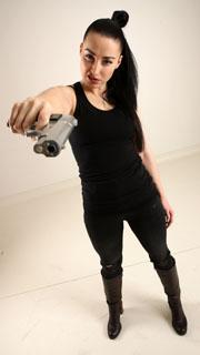 claudia-standing-aiming-pistol 