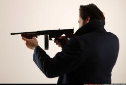 Man Old Average White Fighting with submachine gun Standing poses Coat