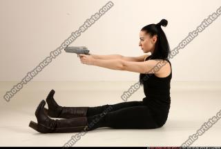 claudia-sitting-dual-pistols