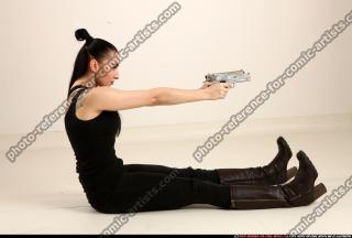 claudia-sitting-dual-pistols