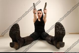 claudia-sitting-dual-pistols