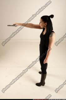 claudia-standing-threatening-pistol