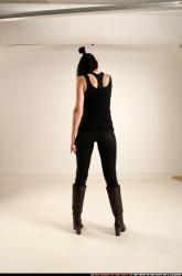 claudia-standing-threatening-pistol