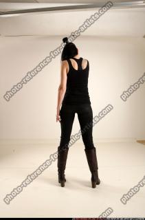 claudia-standing-threatening-pistol