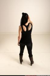 claudia-standing-threatening-pistol