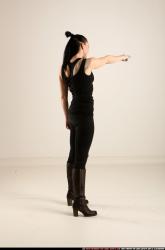 claudia-standing-threatening-pistol