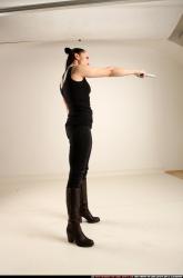 claudia-standing-threatening-pistol