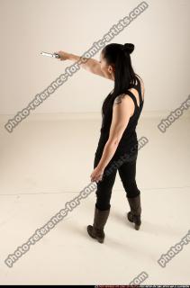 claudia-standing-threatening-pistol