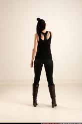 claudia-standing-threatening-pistol