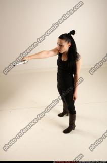 claudia-standing-threatening-pistol