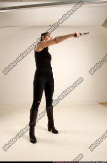 claudia-standing-threatening-pistol