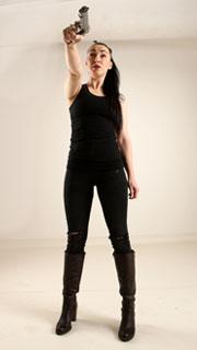 claudia-standing-threatening-pistol