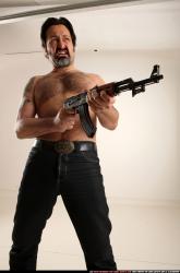 Man Old Average White Fighting with submachine gun Standing poses Pants