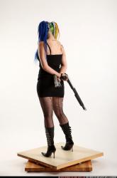 dolores-uzi-shotgun-crossed-behind-back