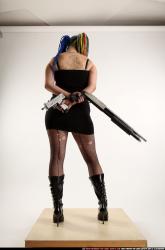 dolores-uzi-shotgun-crossed-behind-back