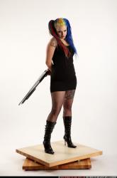 dolores-uzi-shotgun-crossed-behind-back