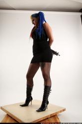 dolores-uzi-shotgun-crossed-behind-back