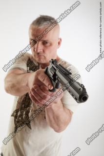 Fighting man with gun Yury