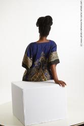 Sitting traditional african woman Dina Moses