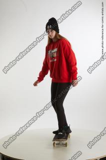 standing teenage girl on skateboard 01
