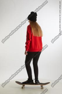 standing teenage girl on skateboard 03