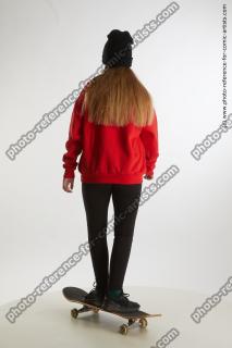 Teenage girl Selin standing on skaterineboard