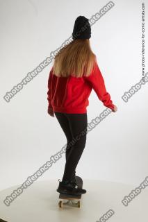 standing teenage girl on skateboard 05