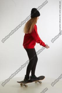 standing teenage girl on skateboard 06