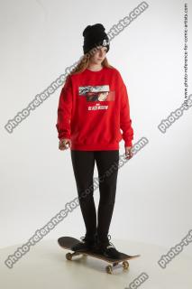 standing teenage girl on skaterineboard 08