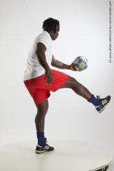 Soccer player with ball Kato Abimbo