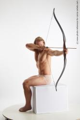 Man Adult Muscular White Fighting with bow Sitting poses Underwear