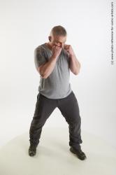 Man Adult Average White Fist fight Standing poses Casual