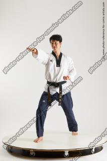 asian man taekwondo poses lan 02b