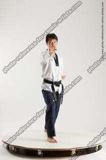 asian man taekwondo poses lan 16b