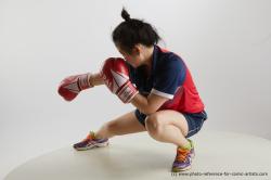 Woman Young Average Kneeling poses Sportswear Asian