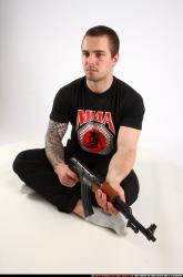 Alex Sitting With Ak-47 Rifle