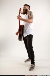 Oscar Playing Guitar