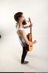 Oscar Playing Guitar