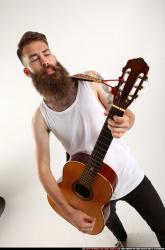 Oscar Playing Guitar