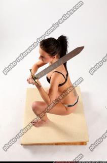 Peggy Kneeling Sword Pose
