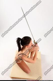 Peggy Kneeling Sword Pose