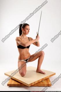 PEGGY KNEELING SWORD POSE2 07 B