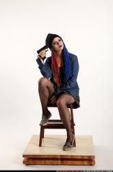 Dolores Sitting Pistol Pose