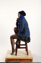 Dolores Sitting Pistol Pose